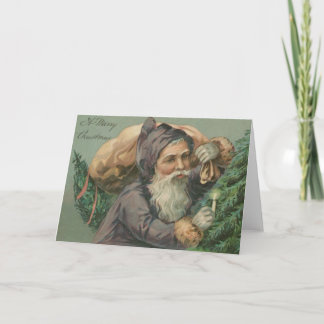 Père Noël avec une carte de Noël de sac