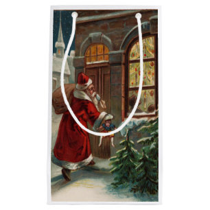 Père Noël dans le sac cadeau de la porte