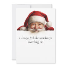 Père Noël regarde une carte de Noël drôle