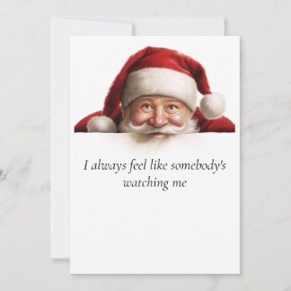 Père Noël regarde une carte de Noël drôle