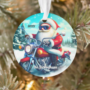Père Noël sur une moto dans la neige