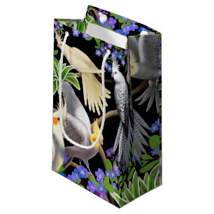 Perroquets de Cockatiel dans le sac de cadeau de