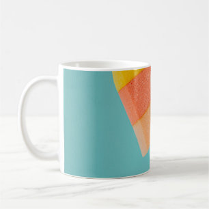 Person mit gelbem und rosa Popsiv Kaffeetasse