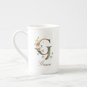 Personalisierte goldene Blumenmonogramm-Initiale G Prozellantasse