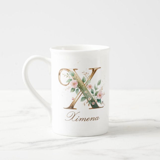 Personalisierte goldene Blumenmonogramm-Initiale X Prozellantasse (Links)