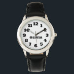 Personalisierte Kinderschau Armbanduhr<br><div class="desc">Dieses Bild zeigt eine Kinderuhr mit einem runden, silberfarbenen Gehäuse mit weißem Ziffernblatt. Die Uhr hat große, leicht zu lesende schwarze Zahlen von 1 bis 12, und die Stunden- und Minutenzeiger sind ebenfalls schwarz, mit den Worten "HOUR" und "MINUTE" beschriftet. Der Name auf der Armbanduhr kann auf jeden beliebigen Namen...</div>