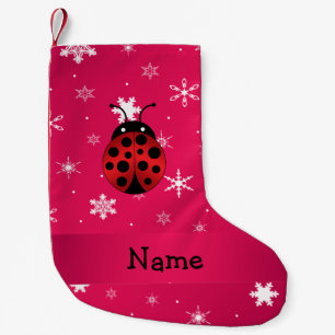 Personalisierte Namensmarienkäferrosaschneeflocke Kleiner Weihnachtsstrumpf