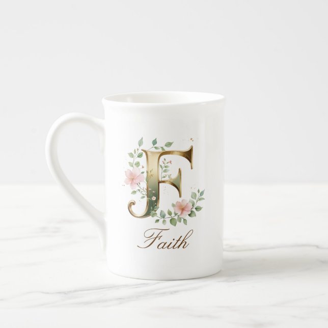 Personalisierter goldener Blumenmonogramm-Initiale Prozellantasse (Links)