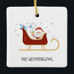 Personalized Fun Covid | Santa Christmas Tree Keramikornament<br><div class="desc">Decorate your tree with this funny santa and his sleigh, carrying covid supplies fun christmas tree decoration. The ornament has corona virus symbols as snowflakes and a sleigh full of covid essentials, tissues, toilet rolls, thermometer, face mask, soap and a hand sanitizer in santas sleigh. Santa sits next to the...</div>