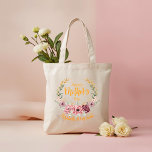 Personalized Happy Mother’s Day Floral Tote Bag Tragetasche<br><div class="desc">Celebrate Mom with this elegant Happy Mother’s Day floral tote bag featuring soft pink blossoms, delicate greenery, and beautiful golden accents arranged in a graceful wreath design. The warm, stylish lettering adds a cheerful and modern touch. Customize this tote with her name, a special message, or meaningful date to create...</div>