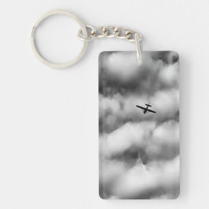 Petit avion volant dans un ciel nuageux Photo