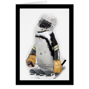 Petit Penguin portant un engin de hockey