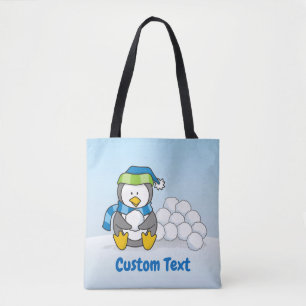 Petit pingouin assis avec des boules de neige sac
