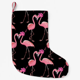 Petite Chaussette De Noël Deux flamants roses sur un arrière - plan noir. In
