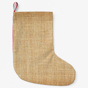 Petite Chaussette De Noël Tissu naturel, arrière - plan texturé.