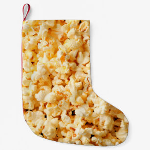 Petite Chaussette De Noël Un bon popcorn sur tout l'arrière - plan. Nourrit