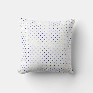 Petits pois bleu cobalt sur un coussin de jet blan