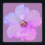 Petunia Floral Weihnachtsname Monogramm Pink Niedl Quadratische Wanduhr<br><div class="desc">Entwickelt mit Petunia Blume abstraktes Foto im Hintergrund mit Vorlagen für mit Monogramm Erstbezug und Namen. Macht eine schöne personalisierte Wohngestaltung Geschenk.</div>