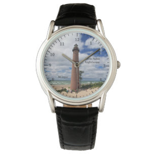 Peu de montre de phare de sable