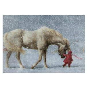 Pferd und Mädchen im Winter Schneidebrett