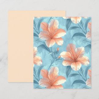 Pfirsich-Hibiskus-Blüten auf weicher blauer Scrapb