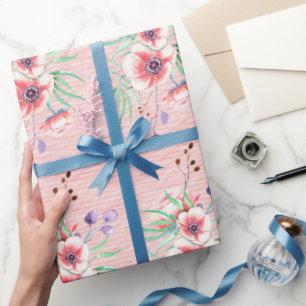 Pfirsichfarbene rosa Blumen auf einem pfirsichfarb Geschenkpapier