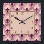 Pflaumenfarbene Art Deco Square Uhr<br><div class="desc">Ich habe diese Art Deko Vorlage genommen und sie für ein paar Artikel in meinem Zazzle-Shop verwendet. Ich habe es hier auf einem 10-Zoll-Quadratzuhr benutzt. Die Farbe ist Pflaume auf einer neutralen Farbe und etwas Gold. Ich denke, das macht eine schöne Art Deko Uhr für Ihre Zuhause.</div>