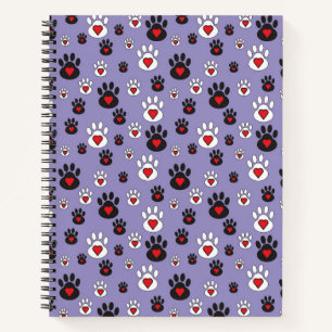 Pfotenabdrücke mit roten Herzen auf blauem Grund Notizbuch