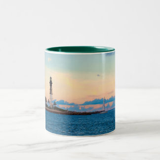Phare à la tasse de coucher du soleil
