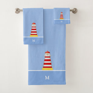 Phare et monogramme sur fond bleu clair