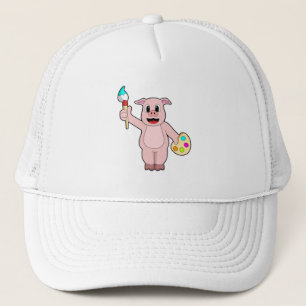 Pig beim Anmalen mit Pinsel und Farbe Truckerkappe