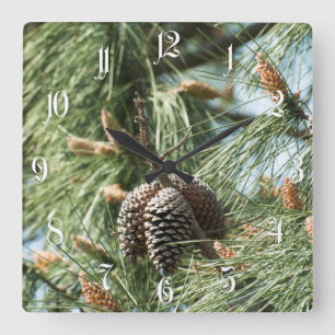 Pine cones on a tree quadratische wanduhr