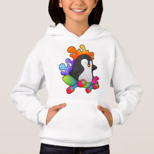 Pingouin en patinage avec skateboard