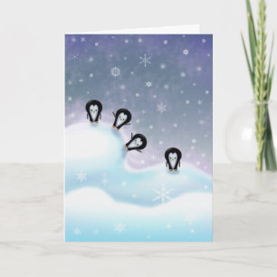 Pingouins ayant la carte de Noël d'amusement