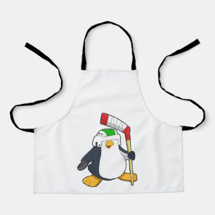 Pinguin beim Eishockey mit Eishockeyschläger Schürze
