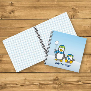 Pinguine beim Schneeballwerfen Notizbuch