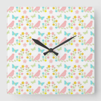 Pink birds and blue butterflies quadratische wanduhr