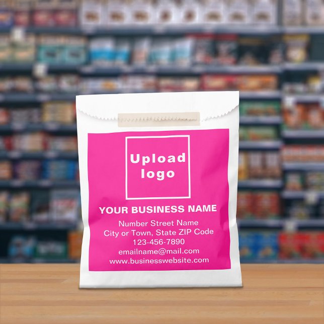 Pink Business Brand on Paper Bag Geschenktütchen (Paper bag with pink business branding displayed in a store)