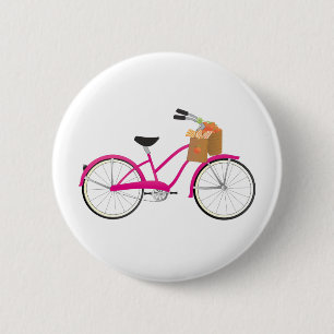 Pink-Fahrrad mit Orangen Button
