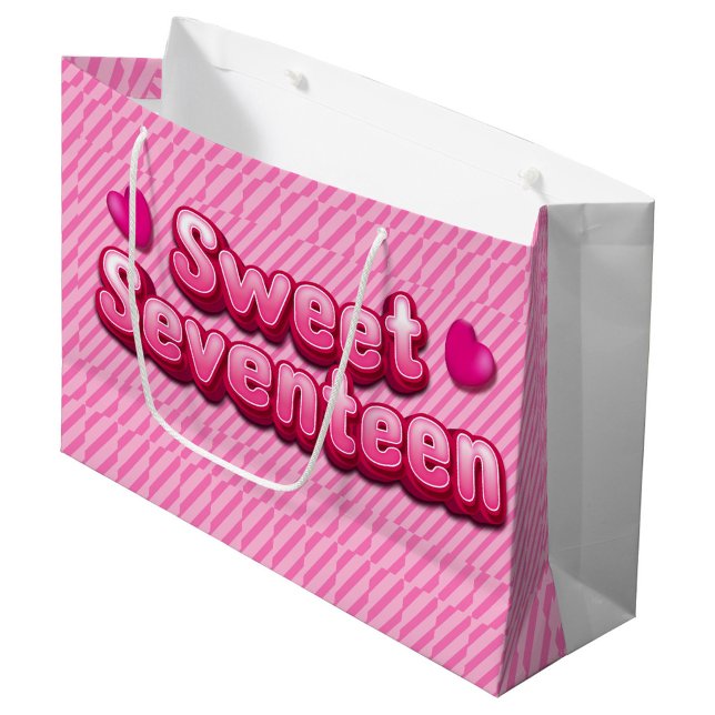 Pink siebzehn große Geschenktasche Geschenktüte (There are two pink hearts, one on either side of the words. The bag has white handles.)