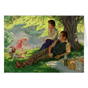 Pique-nique vintage en famille sous un arbre d'omb