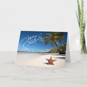 Plage ensoleillée avec carte de Noël Starfish