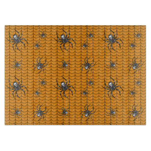 Planche À Découper Araignées sur la table de coupe en verre de parade