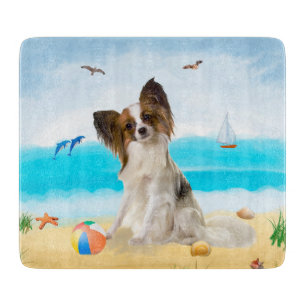Planche À Découper Chien de Papillon sur la plage