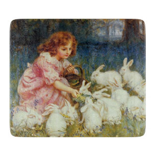 Planche À Découper Fille nourrissant des lapins