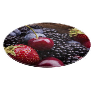 Planche À Découper Fruits savoureux d'été sur un Tableau en bois
