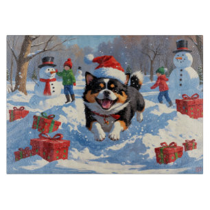 Planche À Découper Japanese Chin courant dans la neige avec un chapea