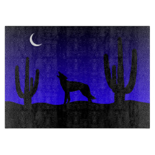 Planche À Découper Loup hurlant silhouette de nuit dans le désert