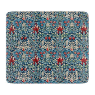 Planche À Découper Motif floral sur fond bleu de feuilles vertes
