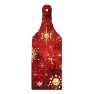 Planche À Découper Noël Golden Snowflakes sur Arrière - plan rouge
